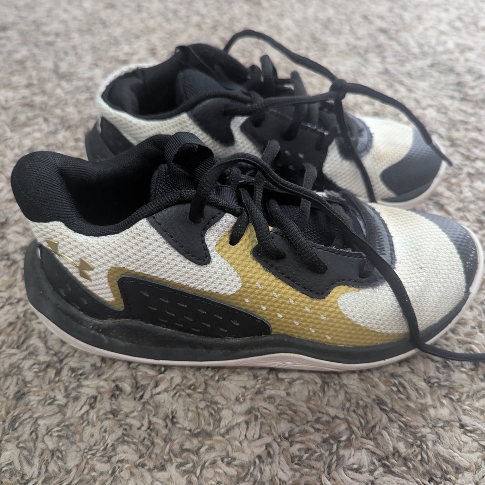 Under Armour Black and Gold Sneakers with Sleek Design
